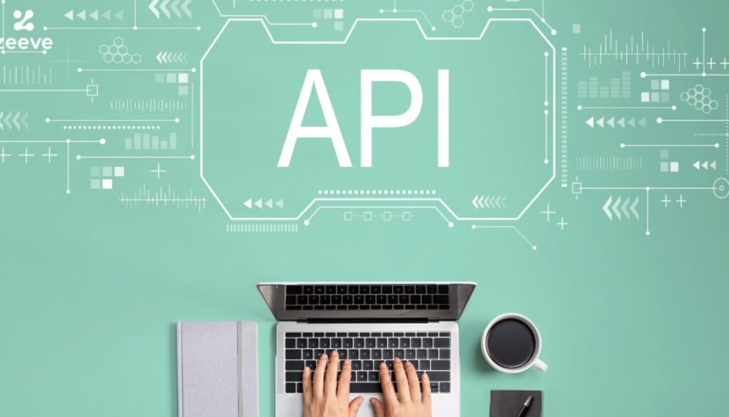Hands typing on laptop with word "API" above on green digital-themed background - WebGrit