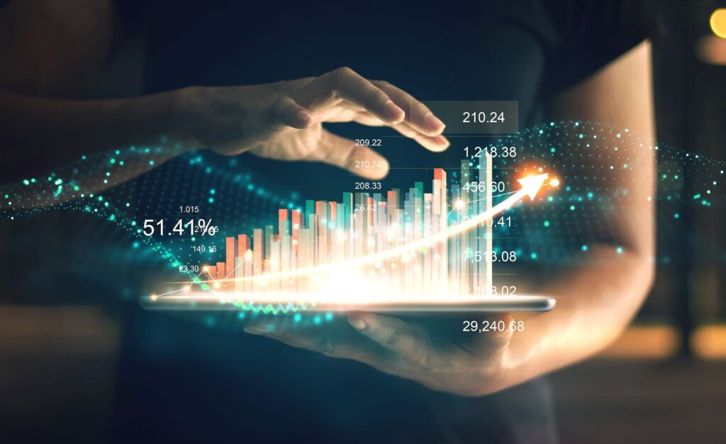 Person's hands hold tablet displaying glowing 3D bar chart with upward curve, symbolizing growth and increasing financial trends - WebGrit